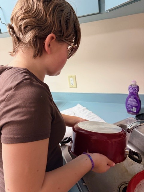 Maddie washed her dishes and put them away after. 