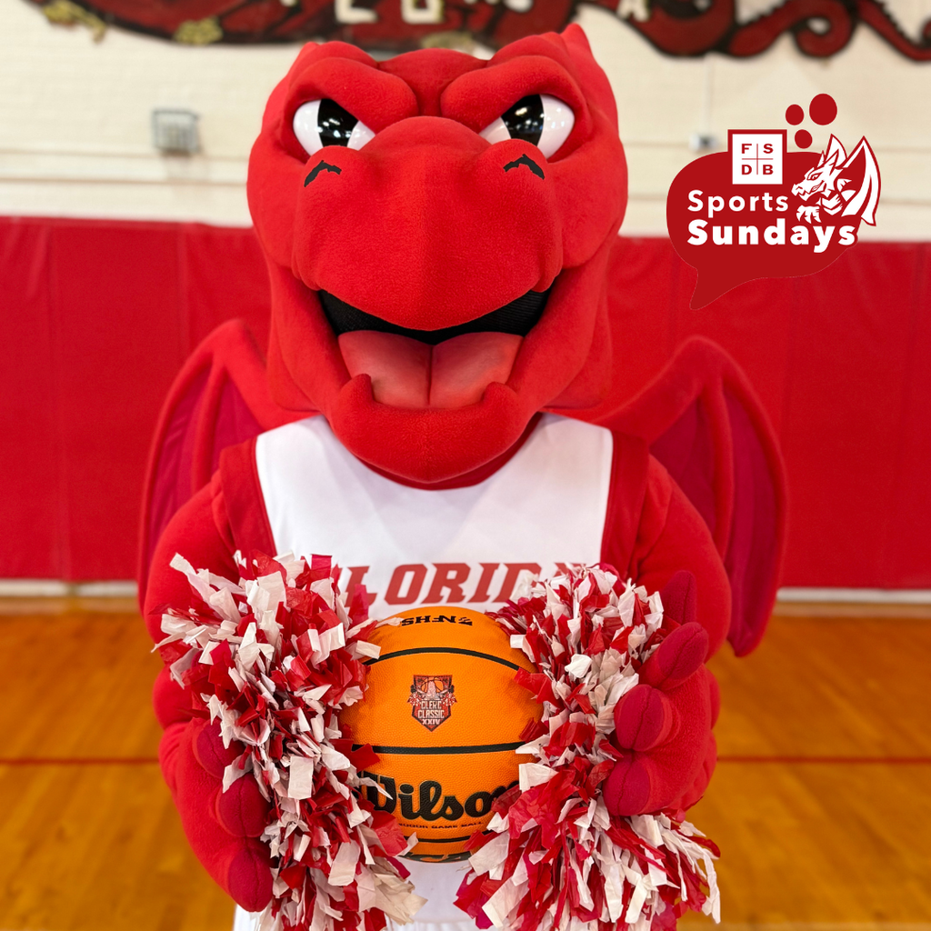 Samy the Dragon holding the Clerc Classic official basketball and cheer pom moms standing in Settles Gym.