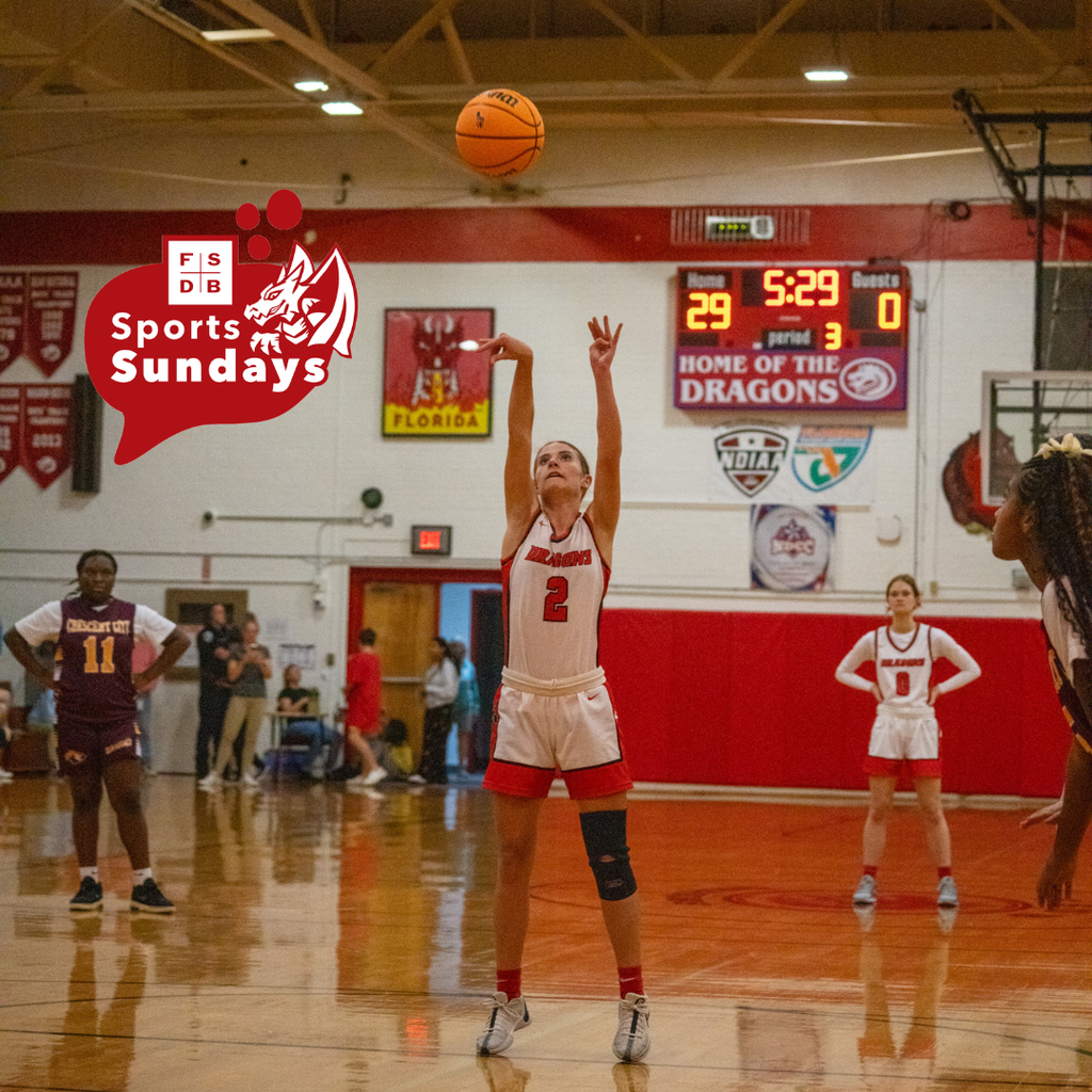 A FSDB basketball player wearing number 2 jersey is shooting for a basket in Settles Gym.