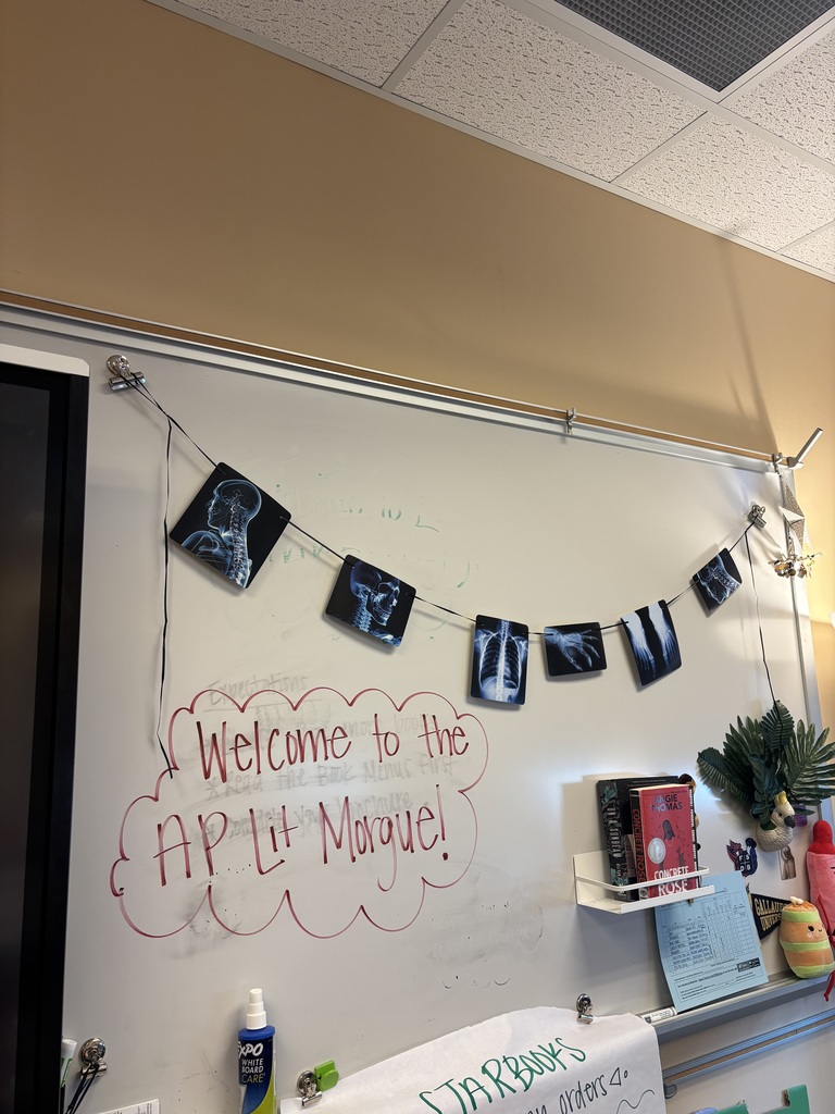 A white board that says "Welcome to the AP Lit Morgue!" with X-ray of bones hanging from above. 