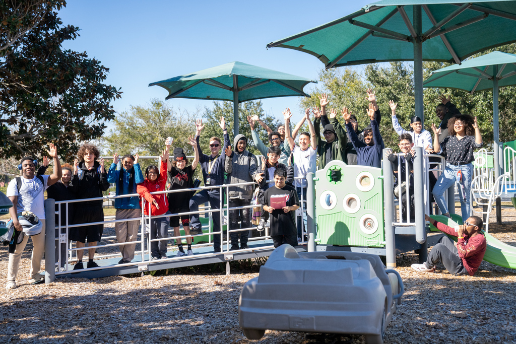 Group photo of the SOAR students and Max in the front on the Kramer playground outside. 