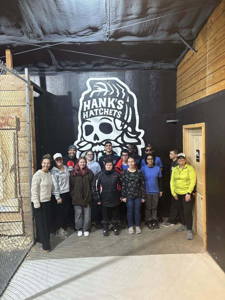 Ski Club group smile for a photo at the local axe throwing in Montana, 
