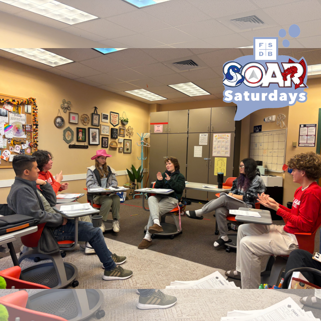 A group of SOAR and Deaf High School students signing to each other discussing the topics taught in class. 