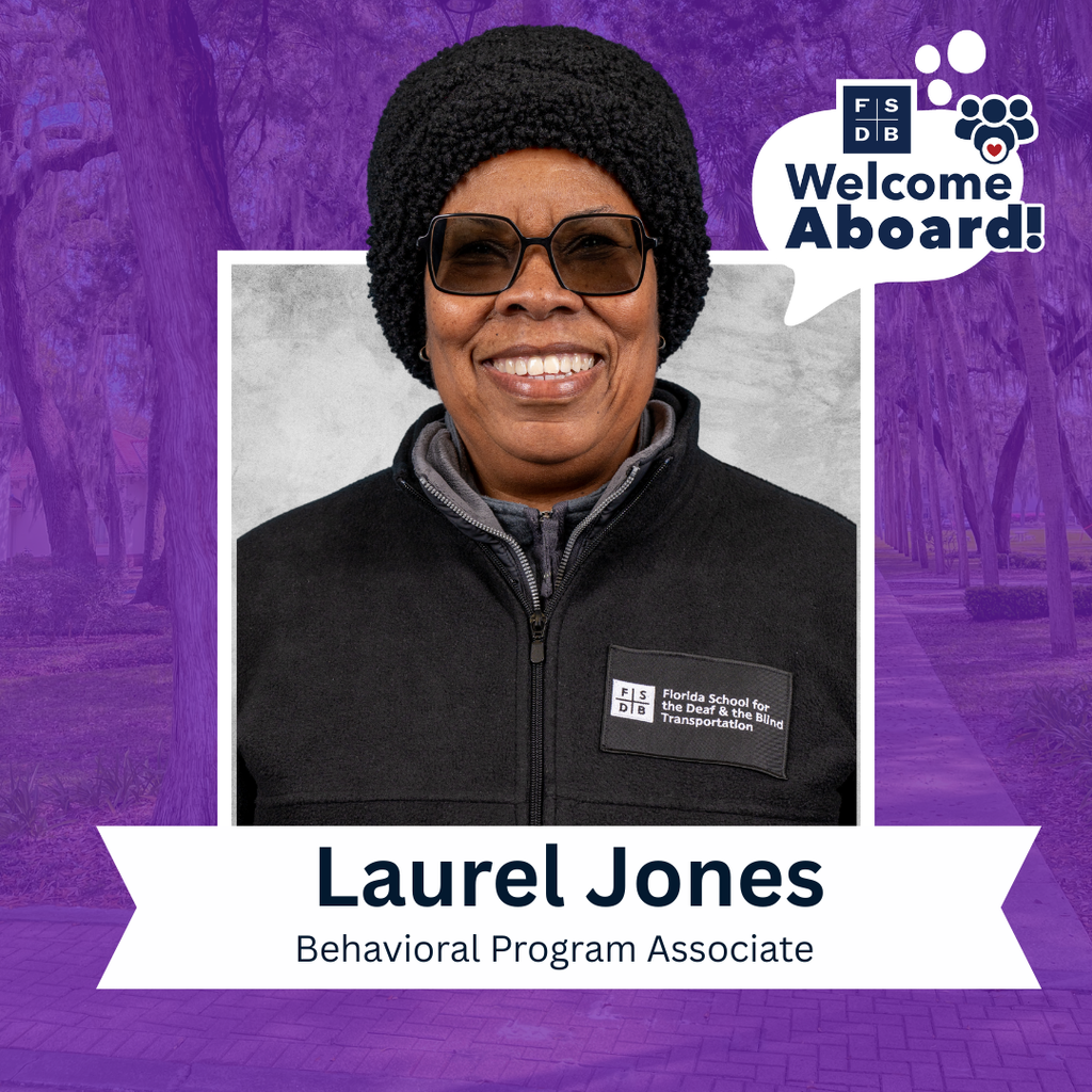 Laurel is wearing a black jacket with "FSDB Transportation" logo on her right shoulder, smiles for her photo with a silver backdrop and purple background. Below her photo is a white textbox that says " Laurel Jones, Behavioral Program Associate" 