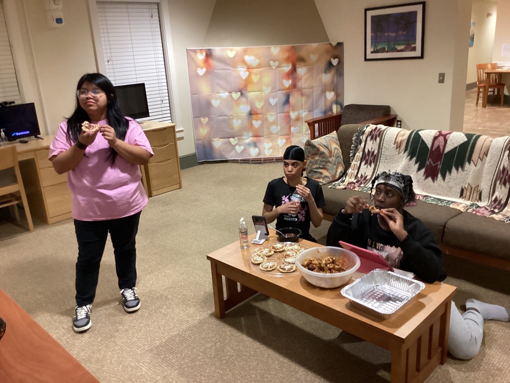 Girl dorm students watch the Super Bowl inside the dorms.