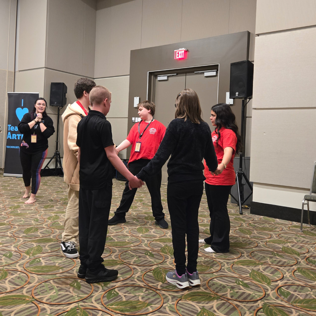 Troupe 11048 working with another troupe from District 2 during a movement workshop, making new friends from across the state