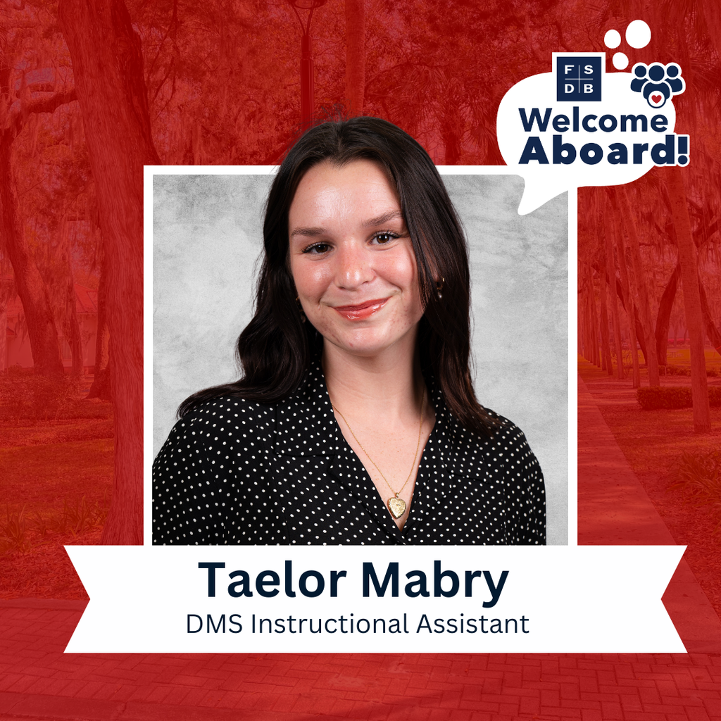 Taelor is wearing a black with white polka dot shirt smiles for her photo with a silver backdrop and red background. Below her photo is a white text box that says "Taelor Mabry, DMS Instructional Assistant"