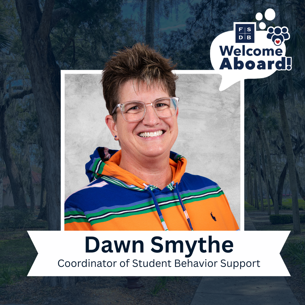 Dawn is wearing an orange, green and blue stripe sweatshirt smiling for her photo with a silver backdrop and navy blue background. Below her photo is a white textbox that says " Dawn Smythe, Coordinator of Student Behavior Support"