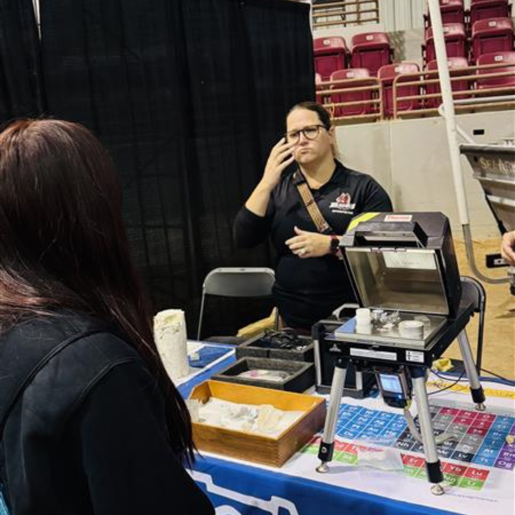 An FSDB interpreter signing explaining the exhibits the students were looking at. 
