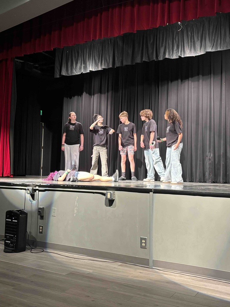 FSDB students on stage performing inside the CSDR theatre room.
