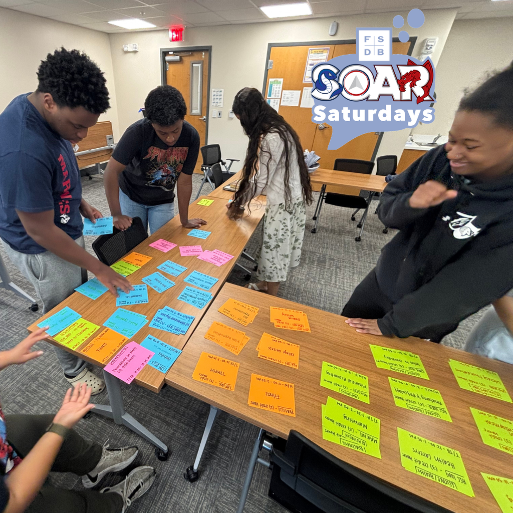 A wide shot photo of the SOAR students working on the activity inside a classroom.