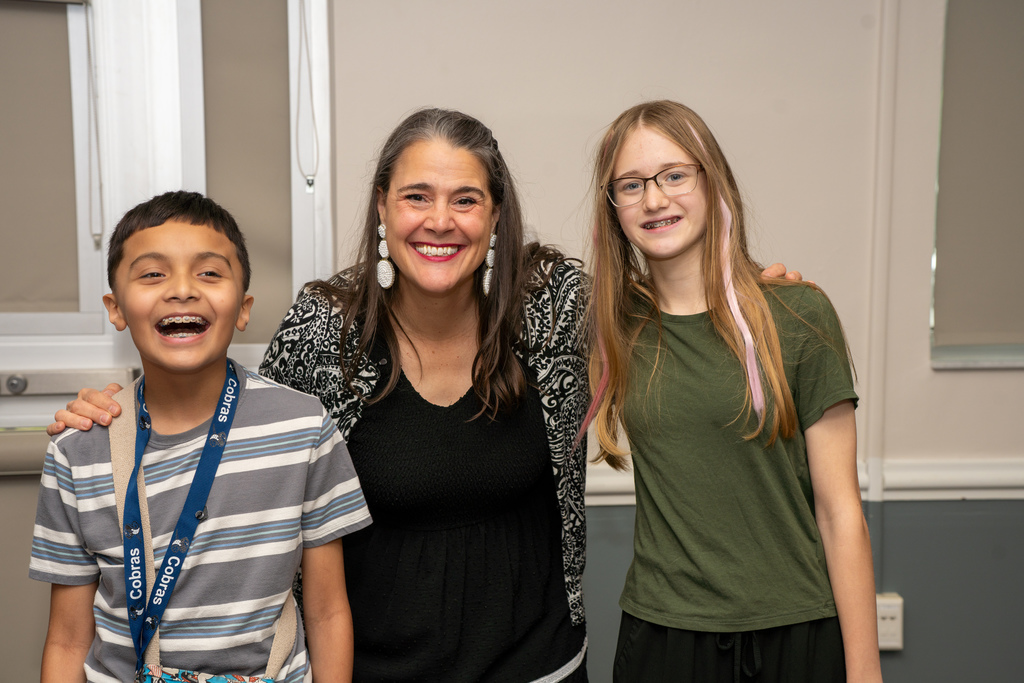 President Snow smiles with a deaf and blind student inside CLD.