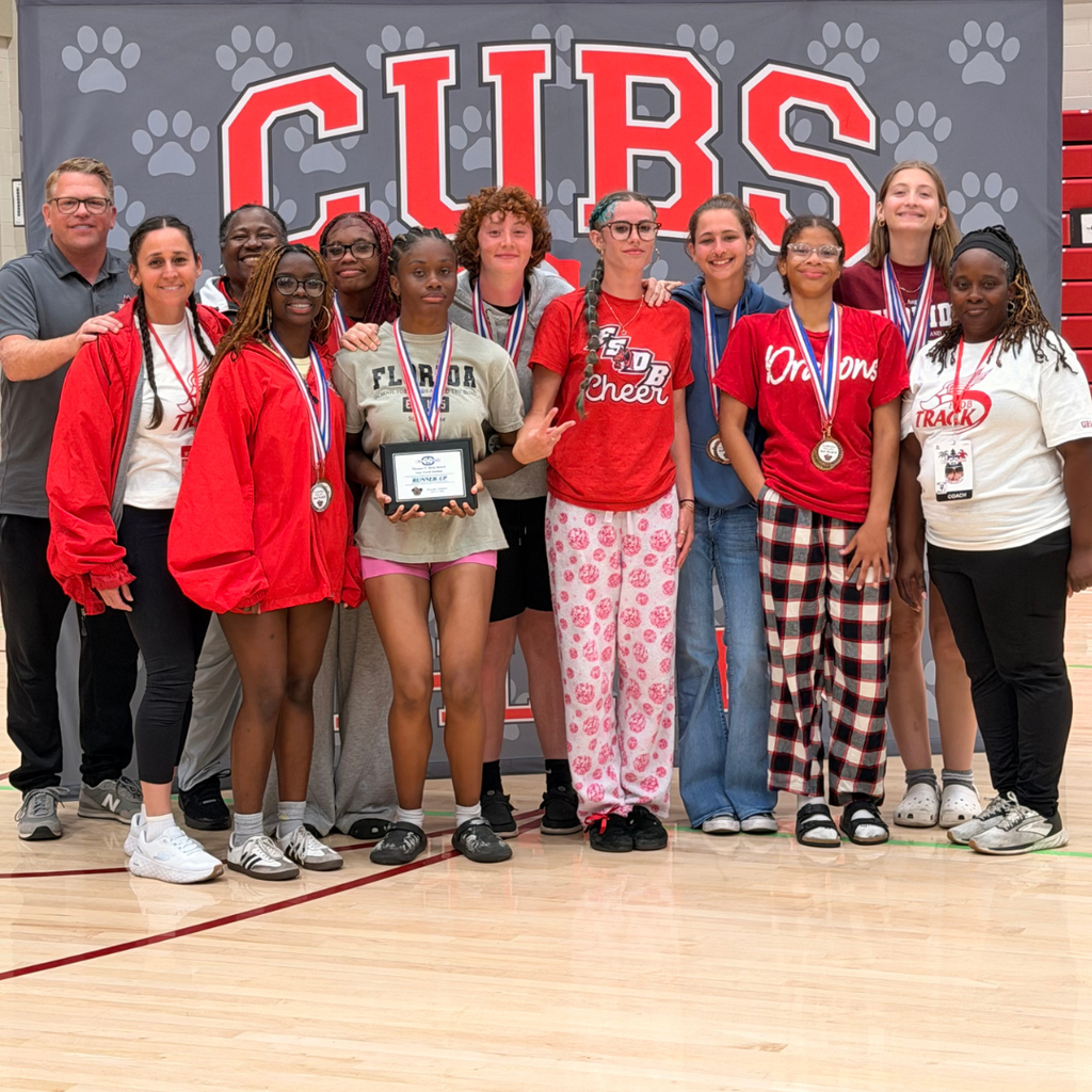 FSDB Girls Track & Field team smile for a photo inside the CSDR gym.