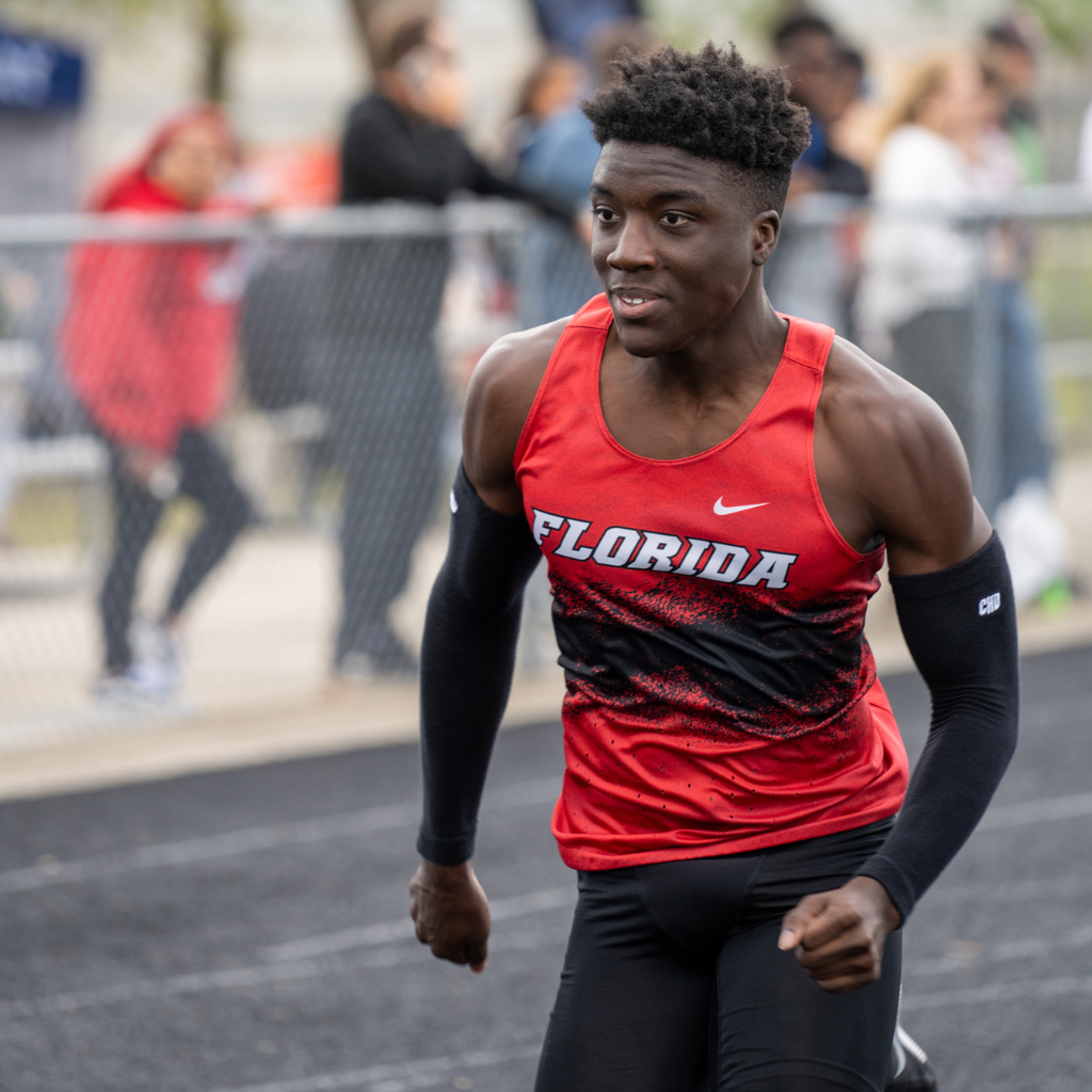 A FSDB boy runner focuses on running to the finish line. 
