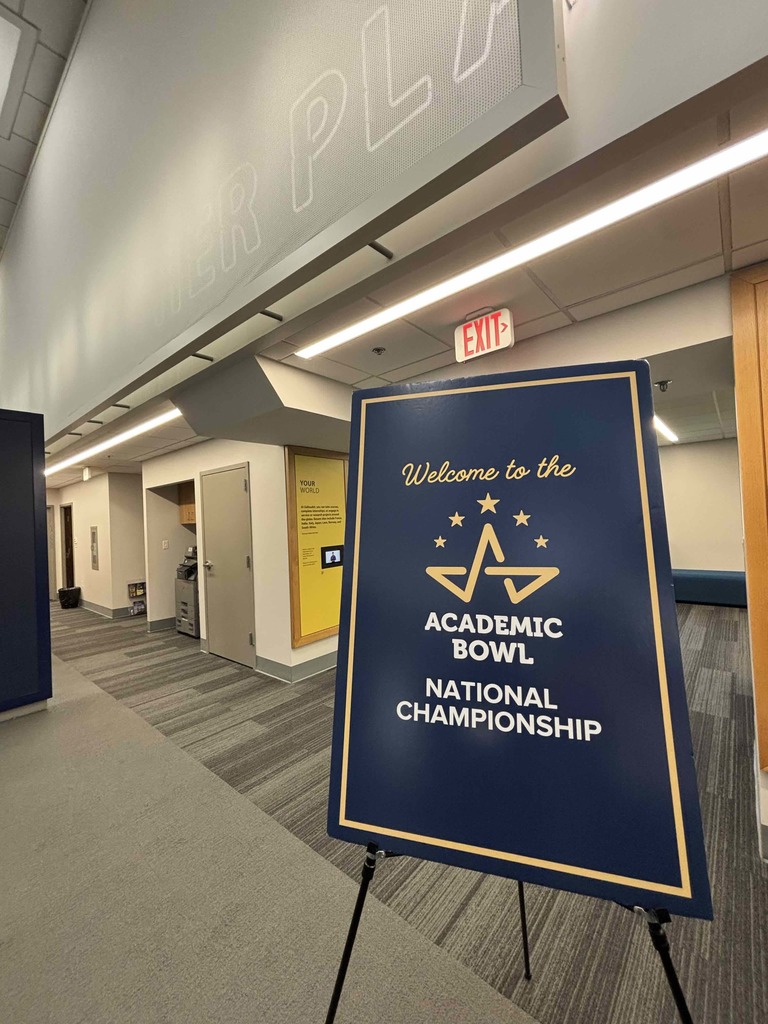 A navy blue sign that says "Welcome to the Academic Bowl National Championship" standing inside Gallaudet University. 