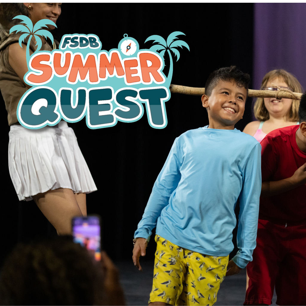 Student doing the limbo at FSDB Summer Quest.