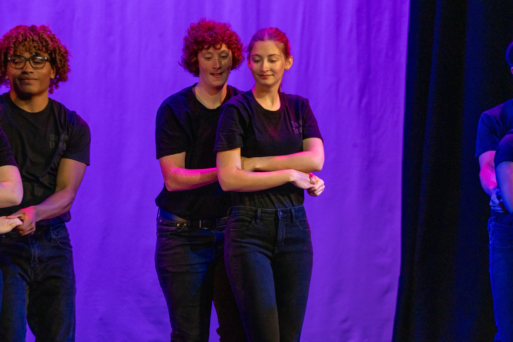 Dance Troupe performers dance on stage in Kirk.