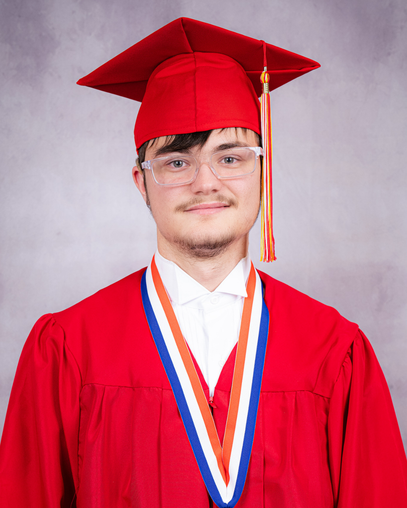 Chase is smiling for his photo wearing his red cap and gown. 