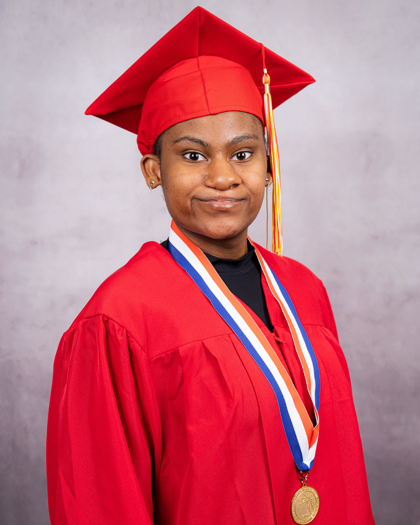 Jannea smiles for her photo wearing her red cap and gown.