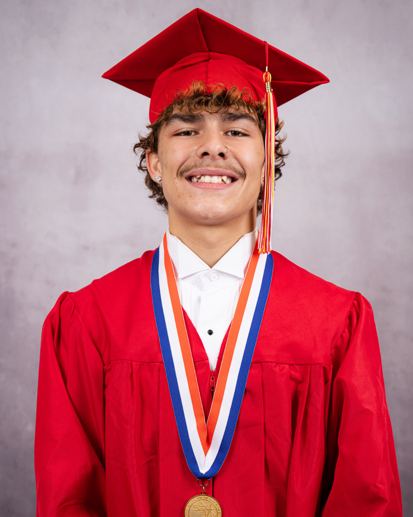 Daniel smiles for his photo wearing his red cap and gown. 
