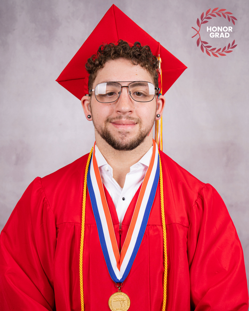 LeSean smiles for his photo wearing his red cap and gown with a "Honor Grad" logo on the top right corner.
