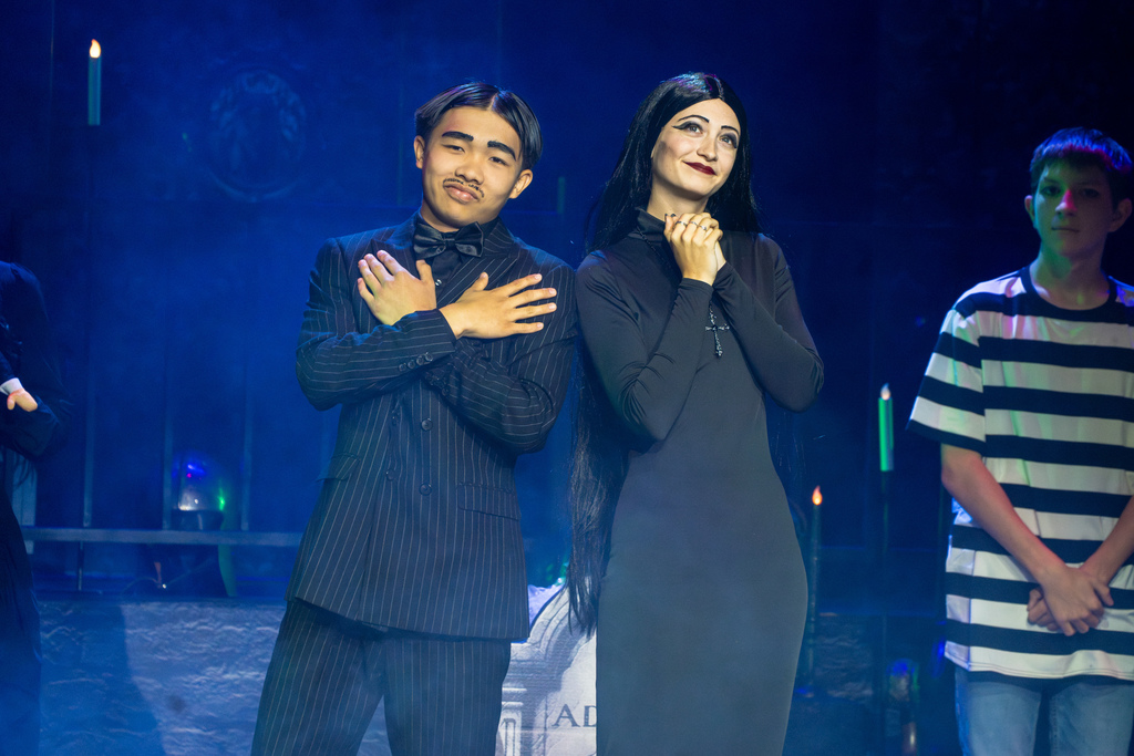 Two students dressed in black perform on stage in Kirk.