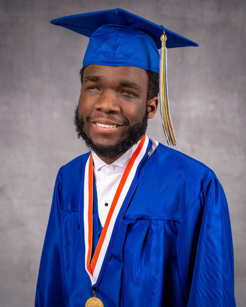 Gamari smiles for his photo with his blue cap and gown.
