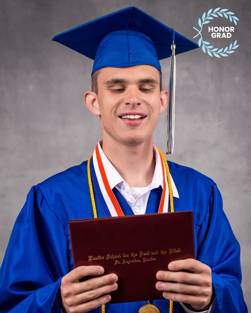 Jasen smiles for his photo in his blue cap and gown, holding his diploma and a "Honor Grad" logo on the top right corner. 