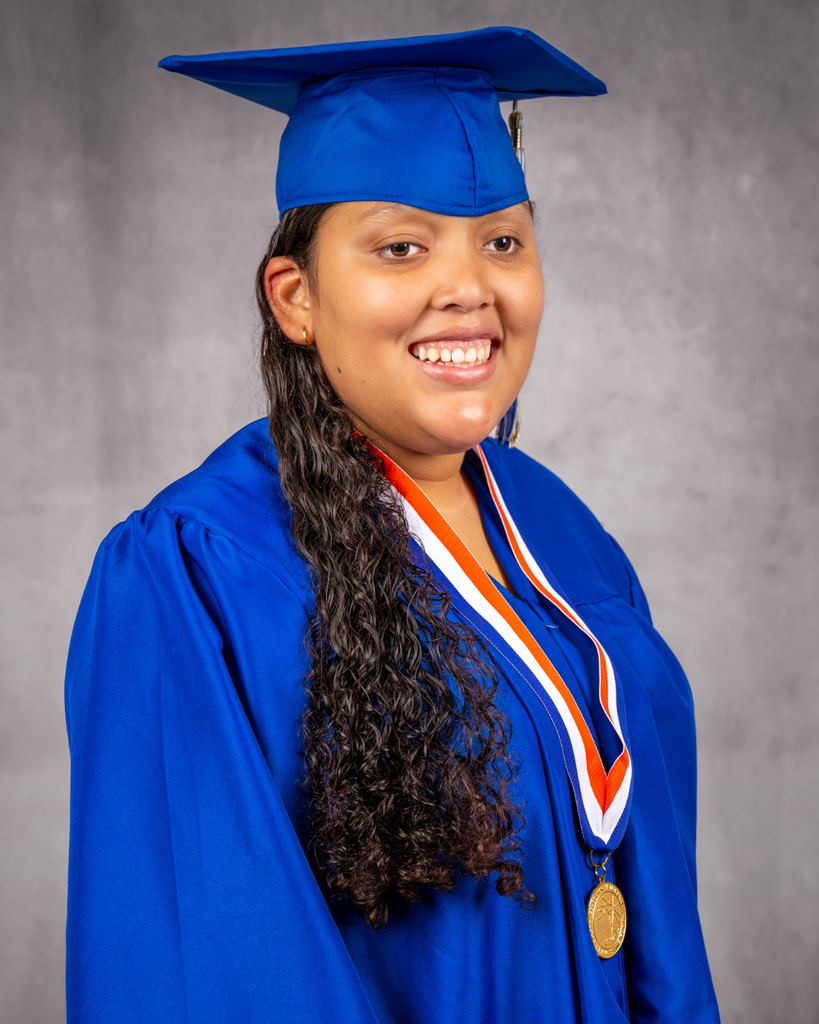 Angelina smiles for her photo wearing her blue cap and gown.