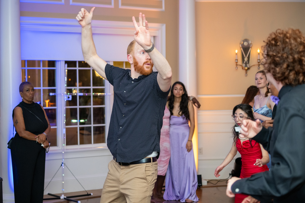 Deaf DJ Nico dances with the students on the dance floor in the River House. 