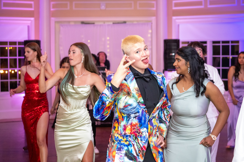 A student pose for a photo inside River House dance floor. 