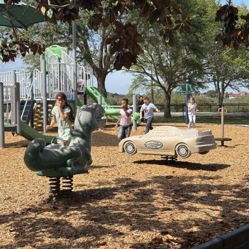 Group of students running and playing on the playground. 