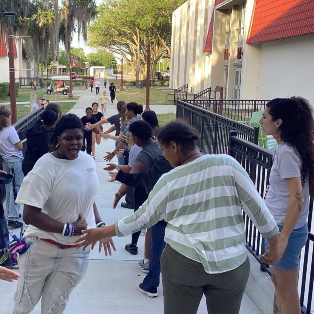 Students high-fiving each other as they complete the hunt.