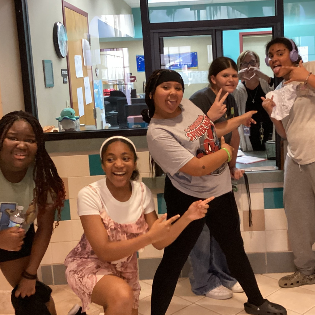 A group of students smile with Health Center.