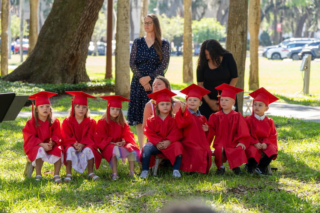 Deaf ELC Graduate Class of 2026 sit at benches at Palm Row.