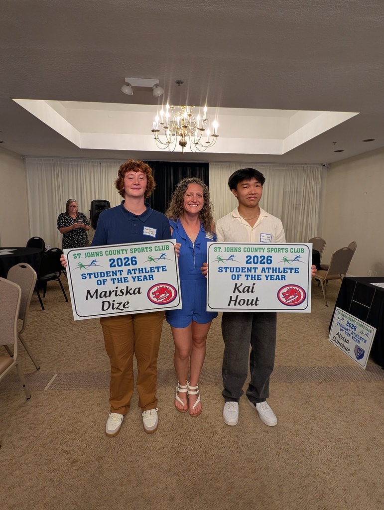 Our two student winners smile with athletic director holding their "St Johns Country Sports Club, 2026 Student Athlete of the Year" with their names on them.