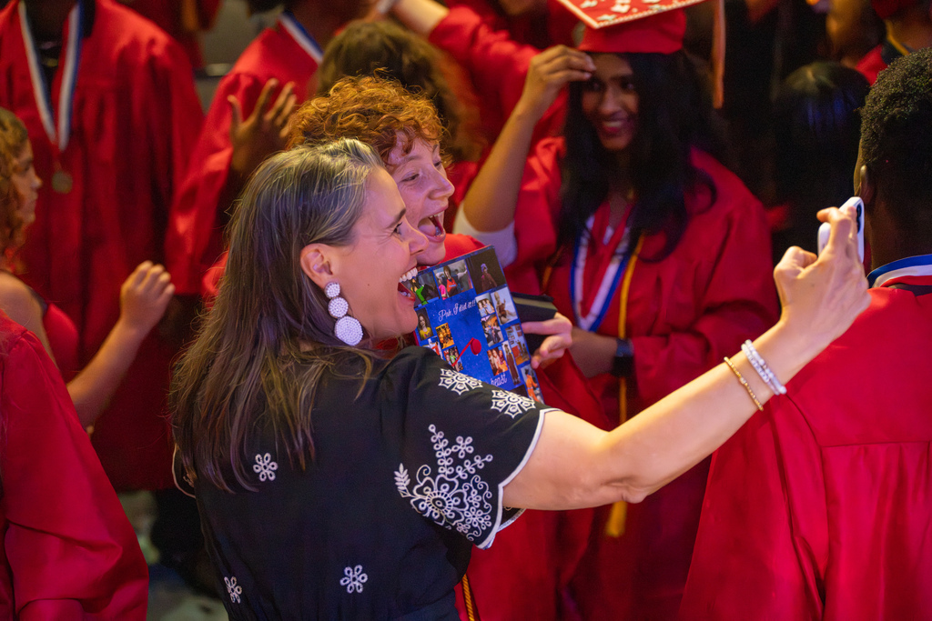 Tracie Snow takes a selfie with a deaf graduate. 