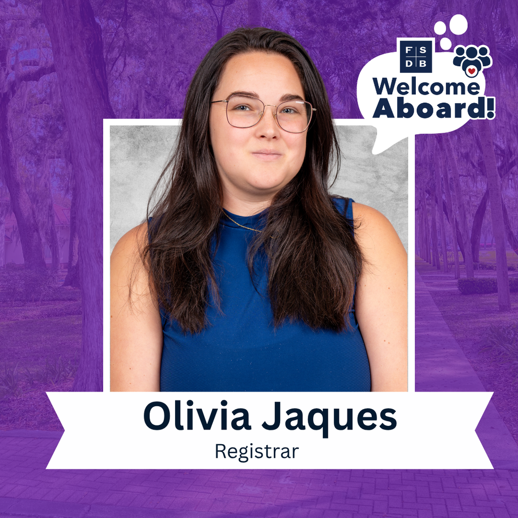 Olivia is wearing a blue tank top smiling for her photo with a purple background and silver backdrop. Below her photo is a white textbox that says "Olivia Jaques, Registrar"