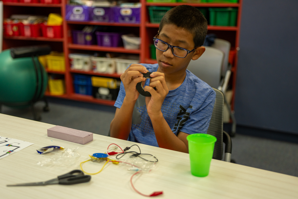 Student works on a project inside the classroom. 