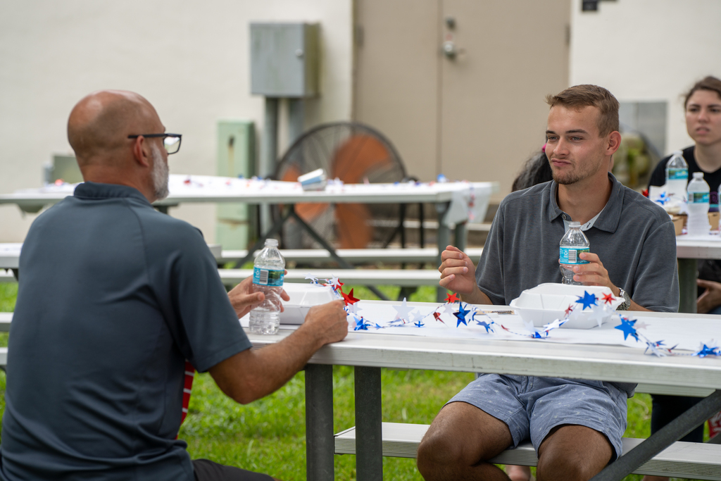 Two staff members chat with each other outside of FSDB.