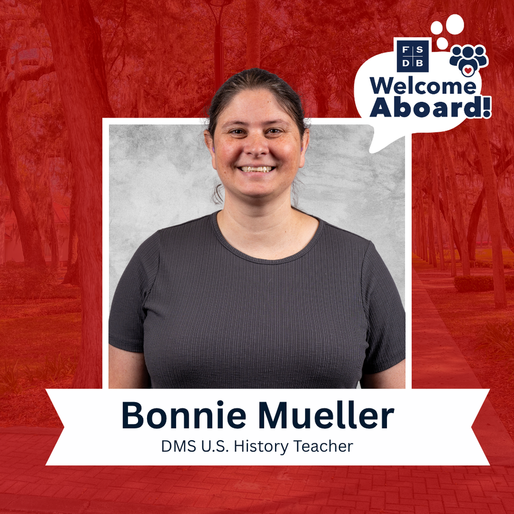 Bonnie is wearing a black short sleeve shirt smiling for her photo with a silver backdrop and red background. Below her photo is a white textbox that says "Bonnie Mueller, DMS U.S. History Teacher"