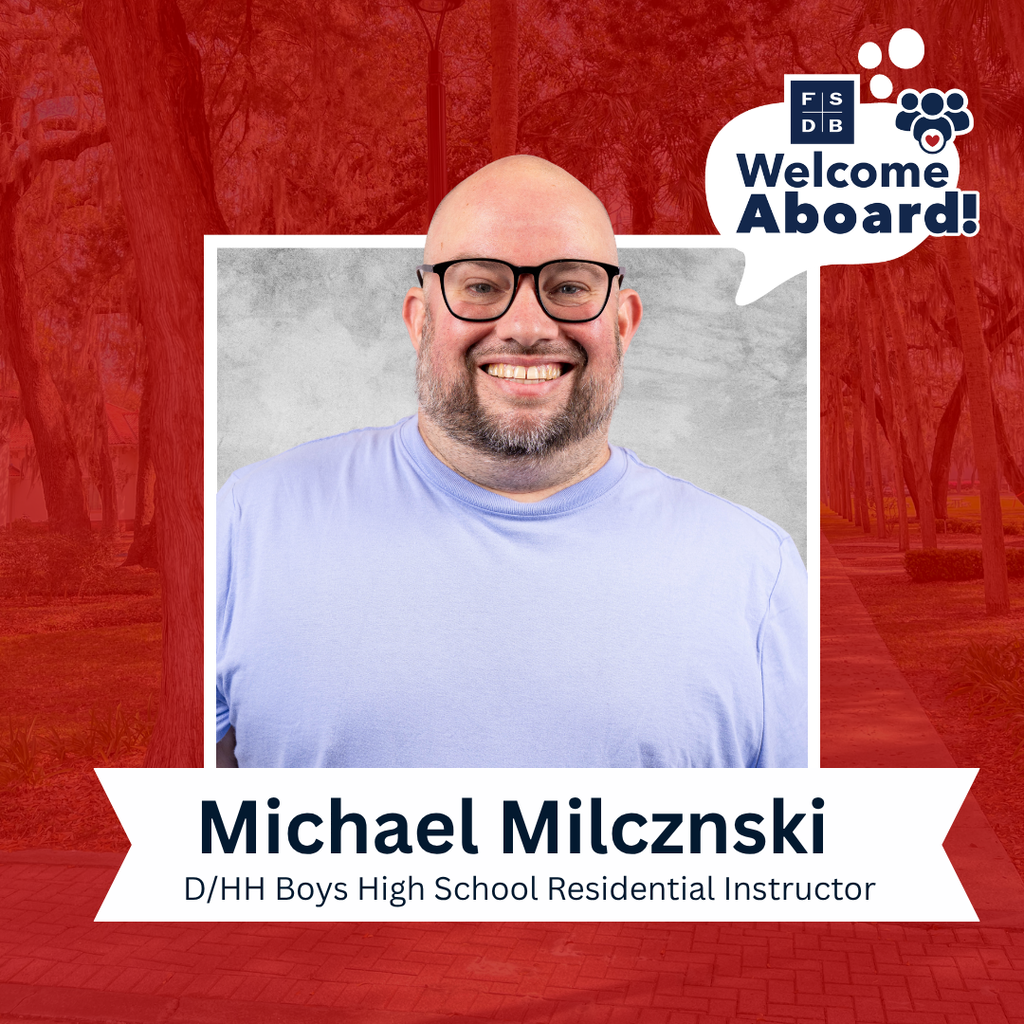 Michael is wearing a light blue shirt smiling for his photo with a silver backdrop and red background. Below his photo is a white textbox that says "Michael Milcznski, D/HH Boys Residential Instructor"