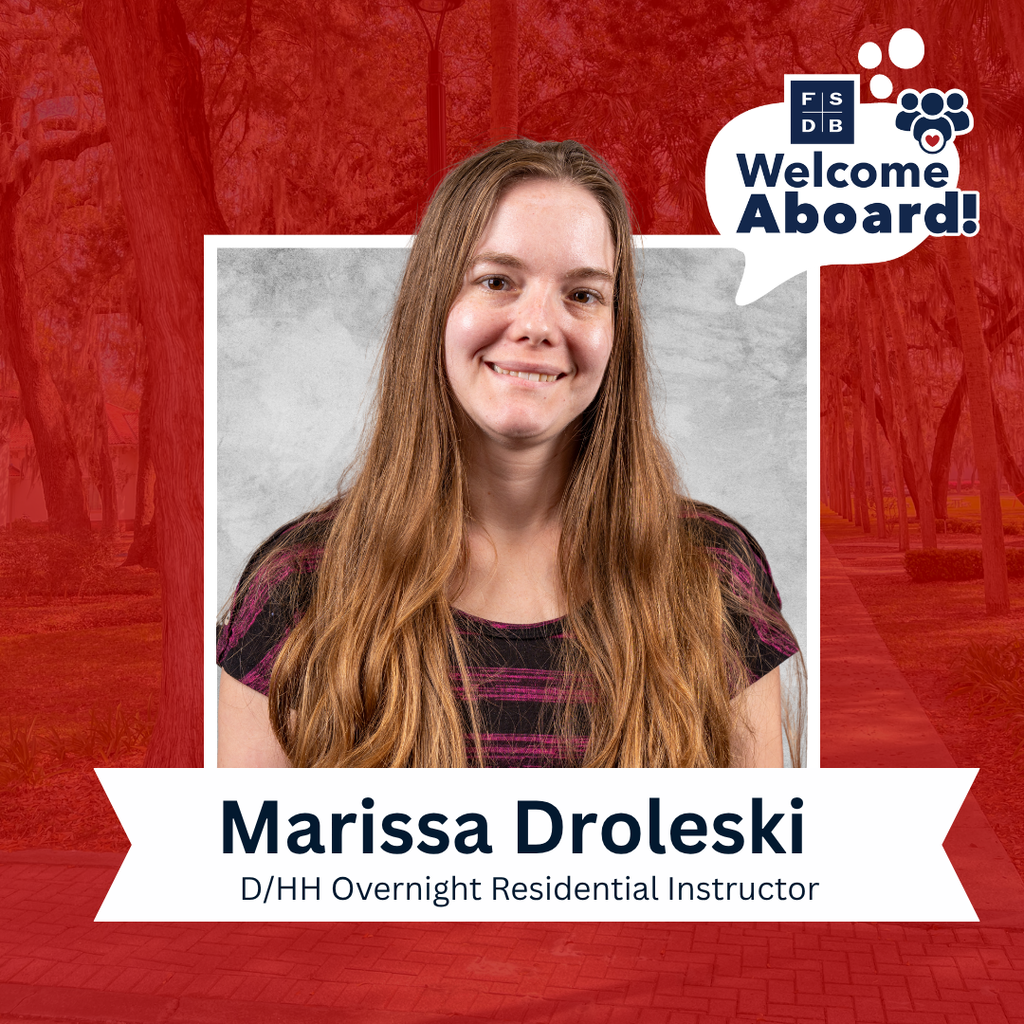 Marissa is wearing a black and pink stripe short sleeve shirt smiles for her photo with a silver backdrop and red background. Below her photo is a white textbox that says "Marissa Droleski, D/HH Overnight Residential Instructor"