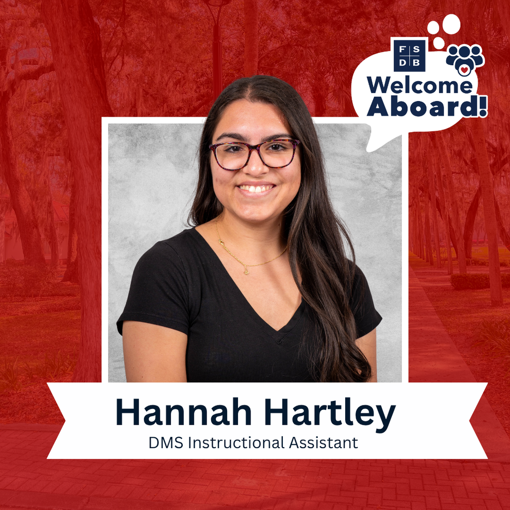 Hannah is wearing a black short sleeve shirt smiling for her photo with a silver backdrop and red background. Below her photo is a white graphic with text that says "Hannah Hartley, DMS Instructional Assistant"