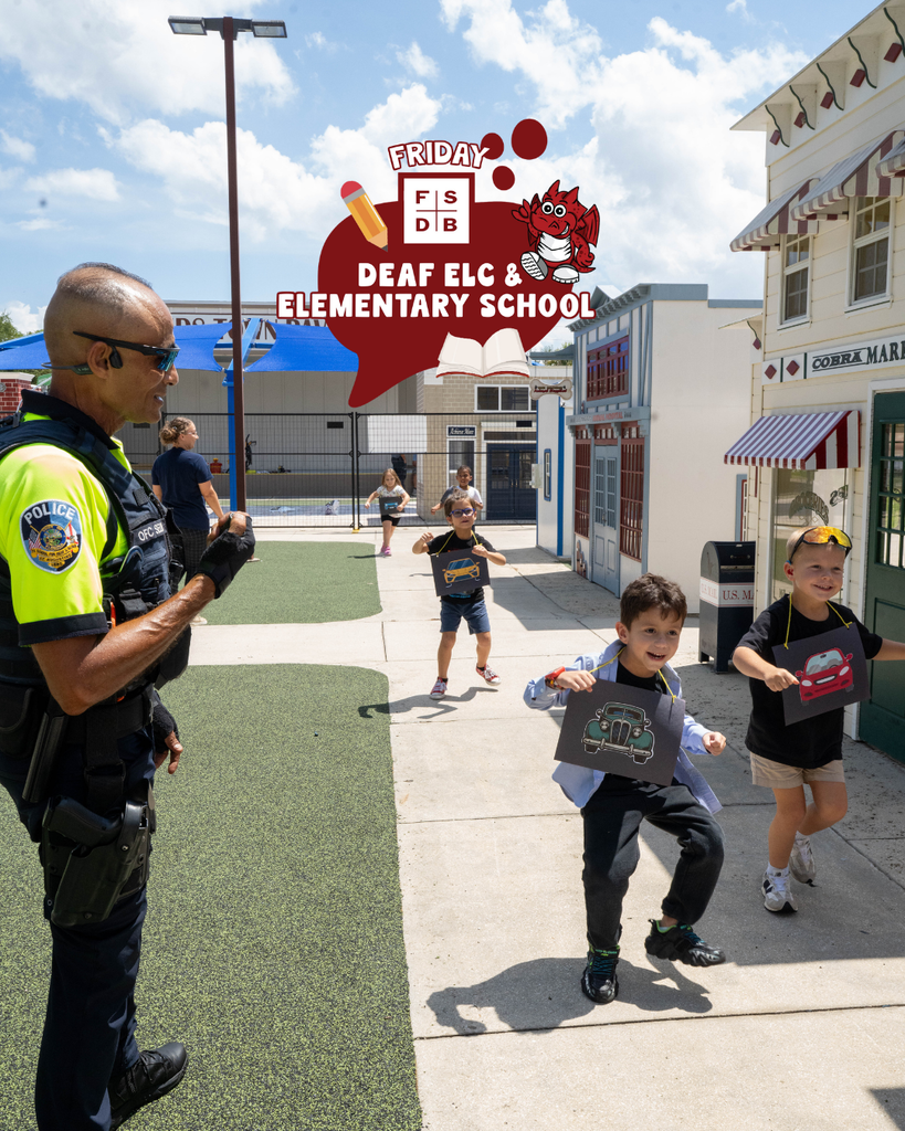 Campus Police watches the students run through Kids Town outside.