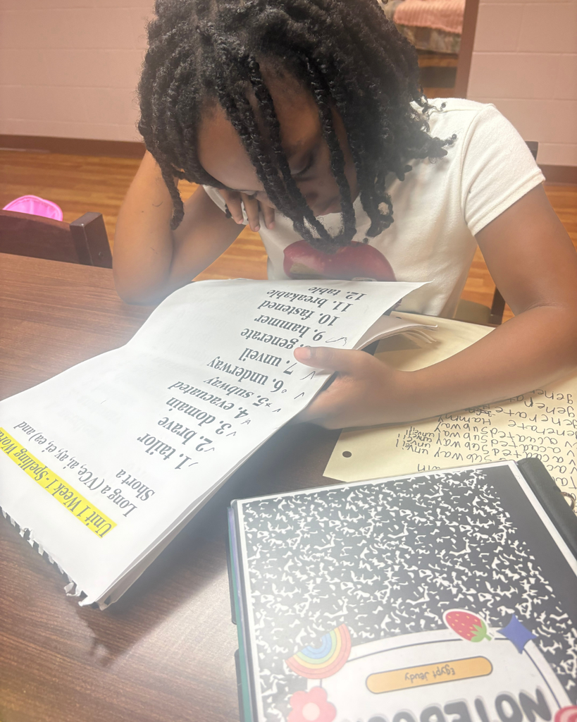 A student works on her homework. 