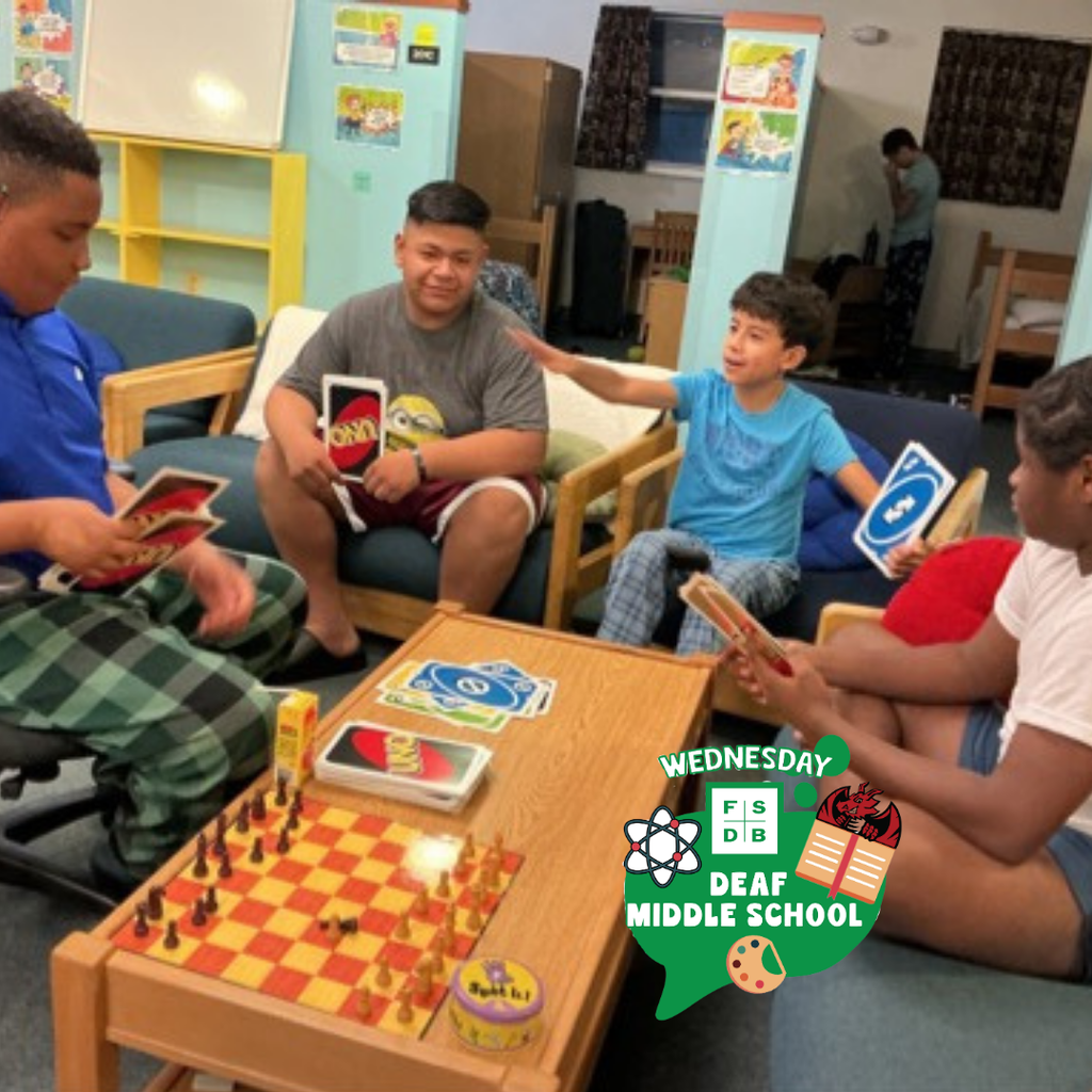 A group of students play uno inside the dorm. 