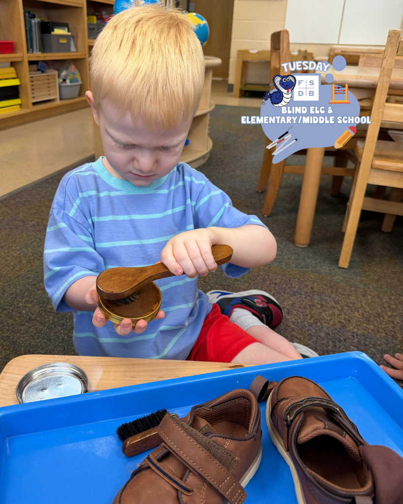 A ELC student is using a brush and learning how to shine shoes.