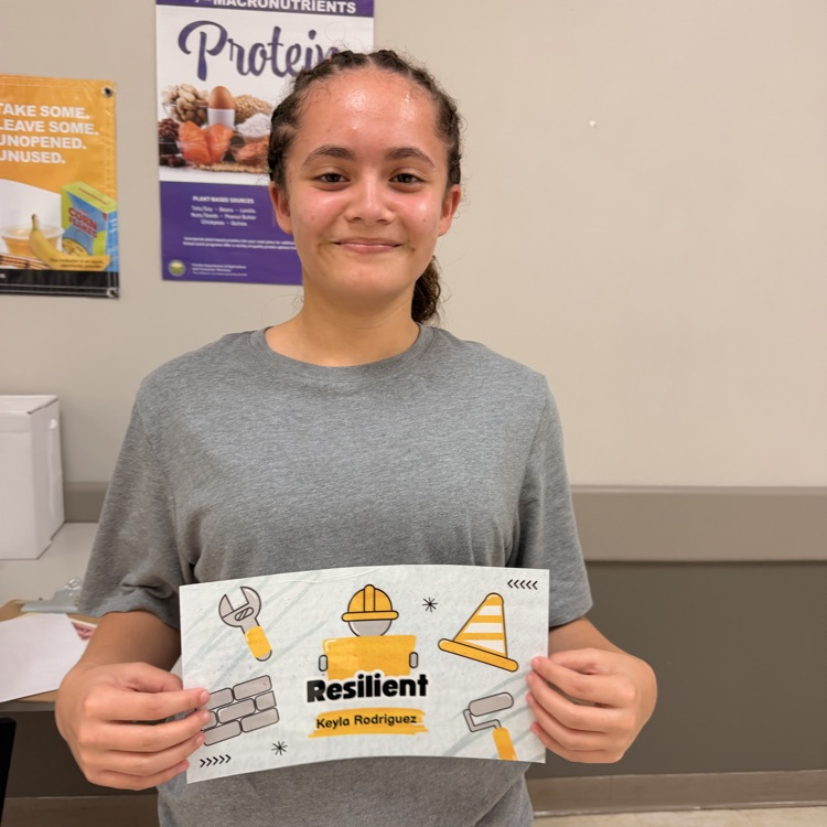 student holding her award 