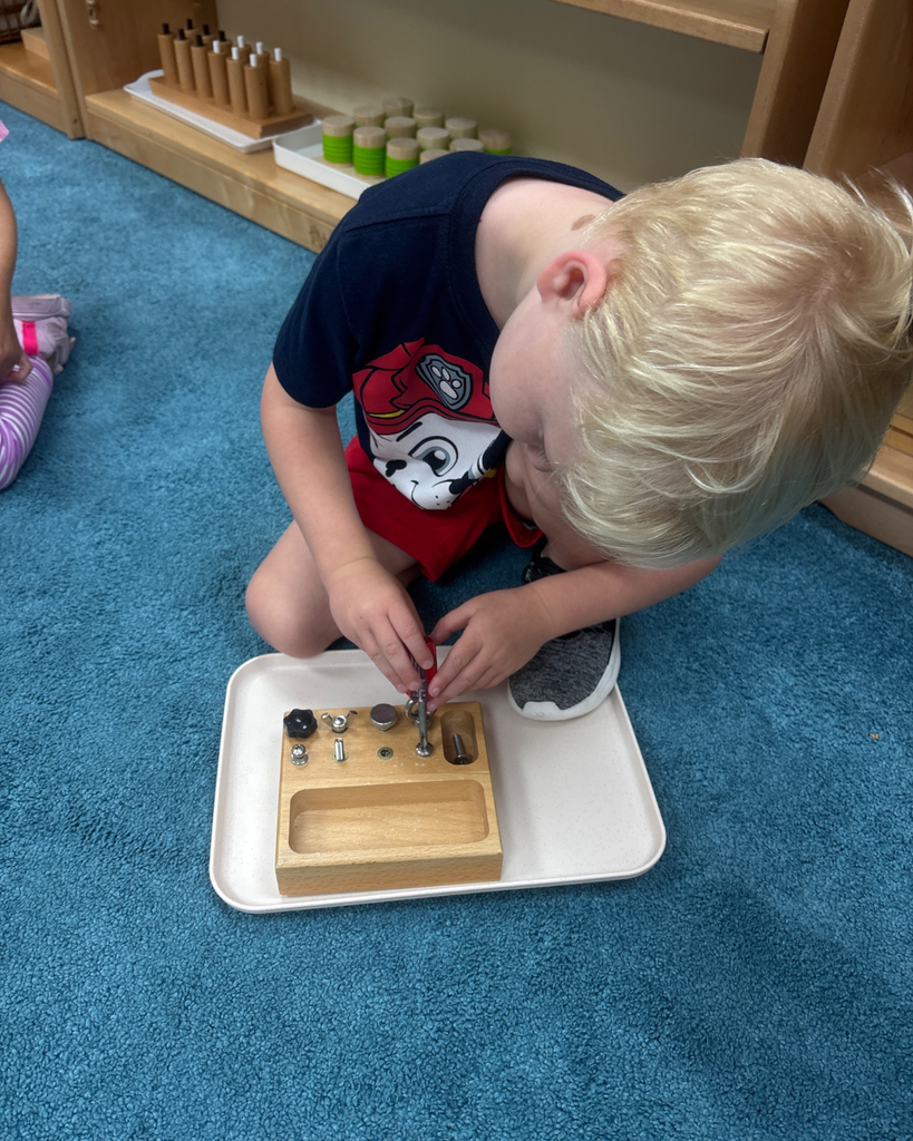 Student works on using a screwdriver. 